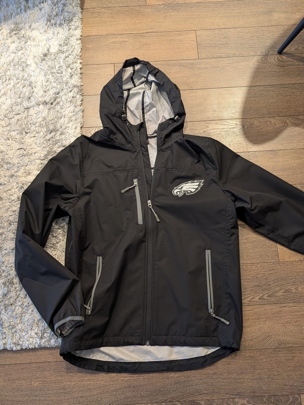 NFL Black Hooded Raincoat with Eagles Logo